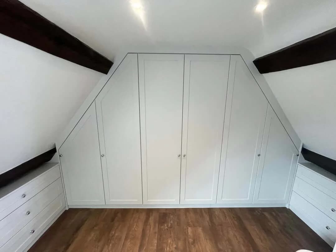 Sloped-ceiling wardrobe with window seats