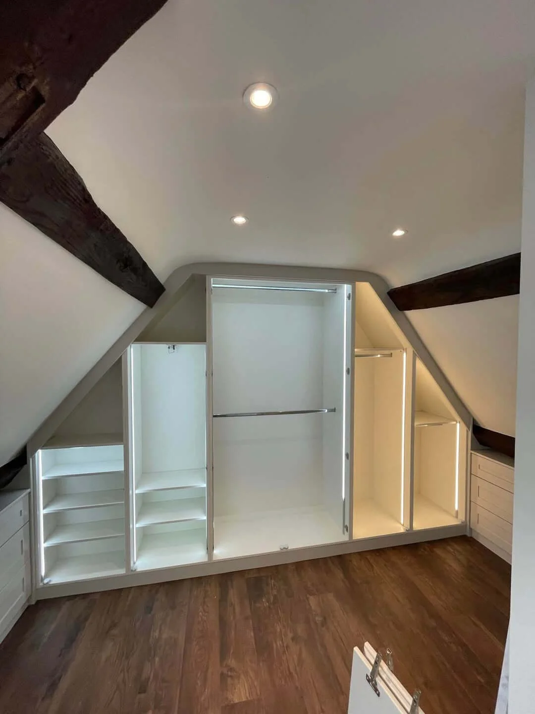 Inside the sloped-ceiling wardrobe