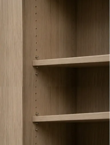 Close-up of a soft-close hinge fitted to a cabinet door